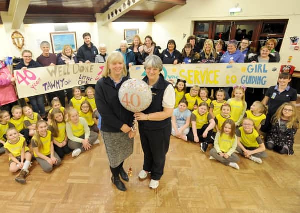 The 16th Blackpool Brownies celebrate their 90th year and 40 years service from leaders Anne Clark (L) and Alison Taylor (R).