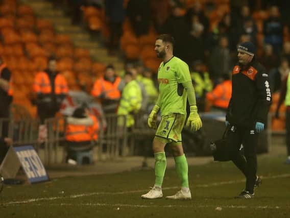 Blackpool's Mark Howard leaves the pitch during last weekend's game after sustaining an injury