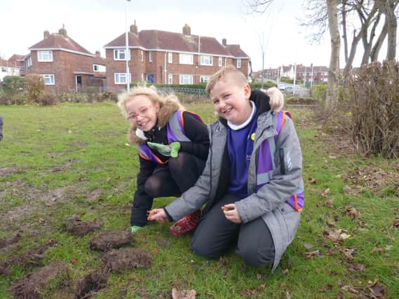 Youngsters from Boundary Primary and Christ the King Catholic Academy planted bulbs at Gateside Park
