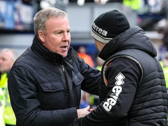 Kenny Jackett greets Gary Brabin ahead of kick-off