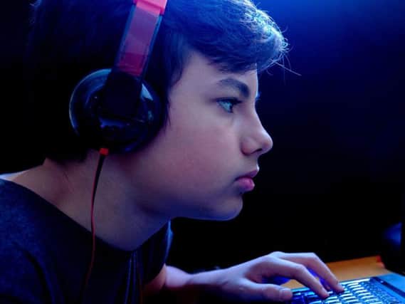 File image of a child playing on a computer