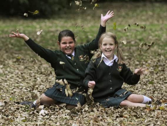 Maricia Doyle and Martyna Chrzanowska, both eight, enjoying Stanley Park last autumn