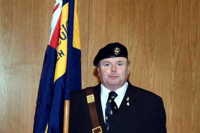 Ian Tomlinson with the Royal British Legion Standard
