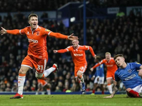 Chris Long celebrates his winning goal on his Blackpool debut at Portsmouth