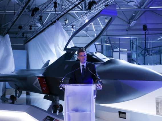 Defence minister Gavin Williamson with a BAE Systems mock-up of a 6th generation aircraft, known as Tempest