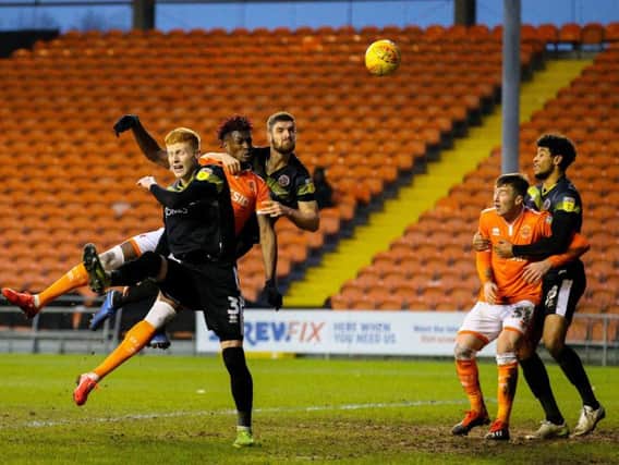 Armand Gnanduillet rises high but he and his Blackpool team-mates couldn't find the net against Shrewsbury
