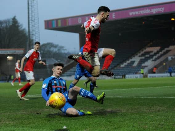 Lewie Coyle takes evasive action but was later sent off at Rochdale