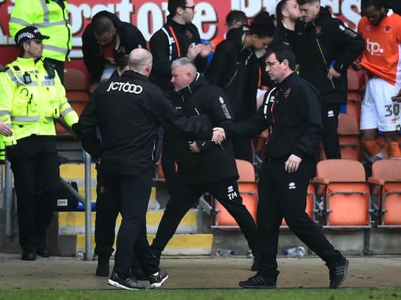 Simon Grayson shakes hand with former Blackpool boss Gary Bowyer after watching his Bradford side lose 5-0 at Bloomfield Road in April 2018
