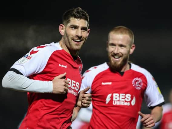 Ched Evans (left) celebrates his first goal at Wimbledon with Paddy Madden