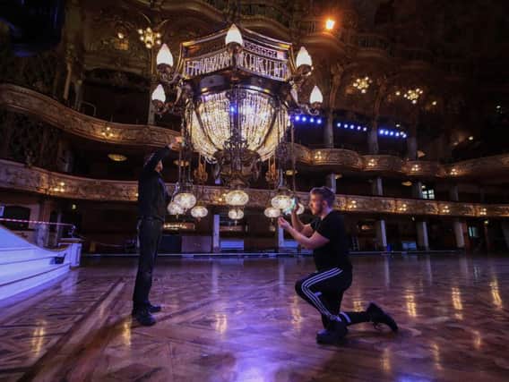 Blackpool Tower's two huge chandeliers are cleaned