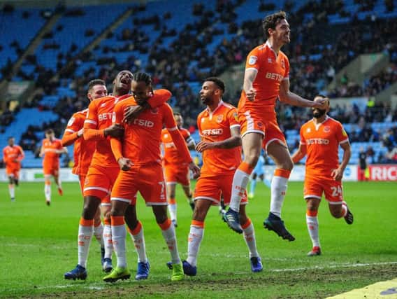 Blackpool players celebrate after Nathan Delfouneso gives the Seasiders the lead