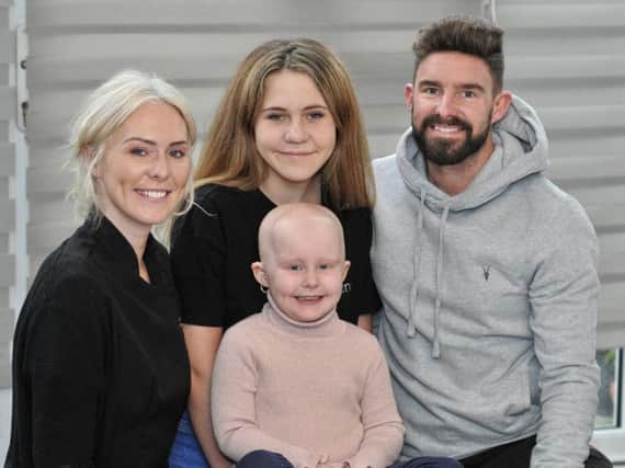 Erin, four, who has Alopecia pictured with her parents Jamie and Tom Didlock and her older sister, Grace, 11, at their Thornton home