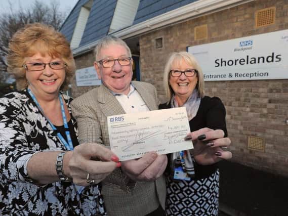 David Dixon presents a cheque to Janet Carter and Julie Marsden from Shorelands
