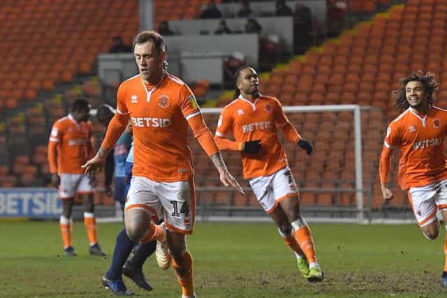 Nya Kirby, right, celebrates after Harry Pritchard dispatched Blackpool's late penalty
