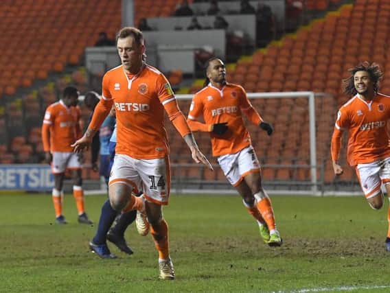 Nya Kirby, right, celebrates after Harry Pritchard dispatched Blackpool's late penalty