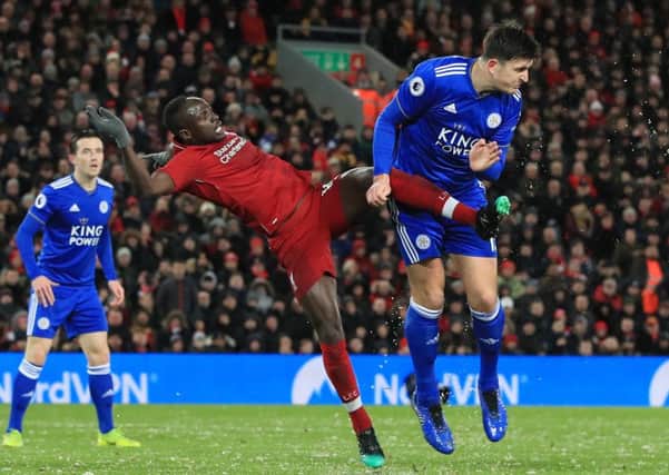 Goalscorers Sadio Mane and Harry Maguire in action during Liverpools Anfield draw with Leicester as the Premier League title race took another twist