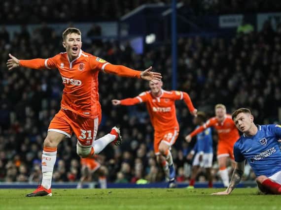 Chris Long, one of six new arrivals in January, celebrates after scoring on his Blackpool debut