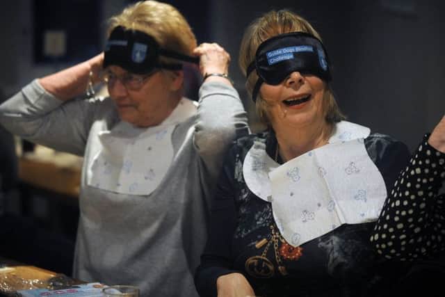Diners at The Venue in Cleveleys ate their Sunday dinner blindfolded to raise funds for the Guide Dogs charity.
Diners get accustomed to their blindfolds.  PIC BY ROB LOCK
3-2-2019
