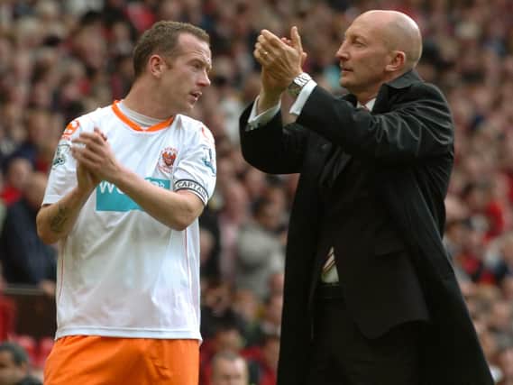 Ian Holloway and Charlie Adam applaud the Blackpool fans after the Seasiders' relegation was confirmed at Old Trafford