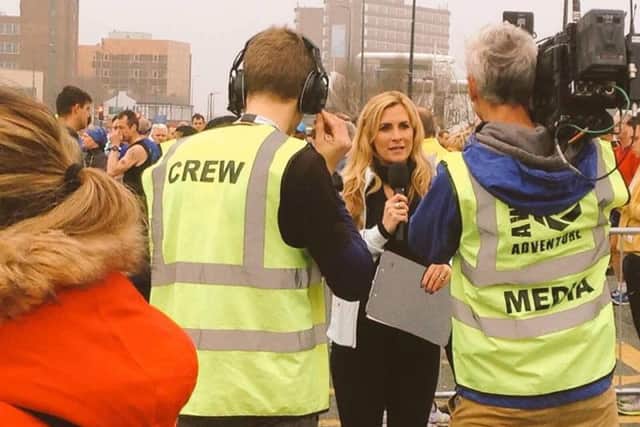 The team from AWOL Adventures of Kirkham filming on location at the Manchester marathon