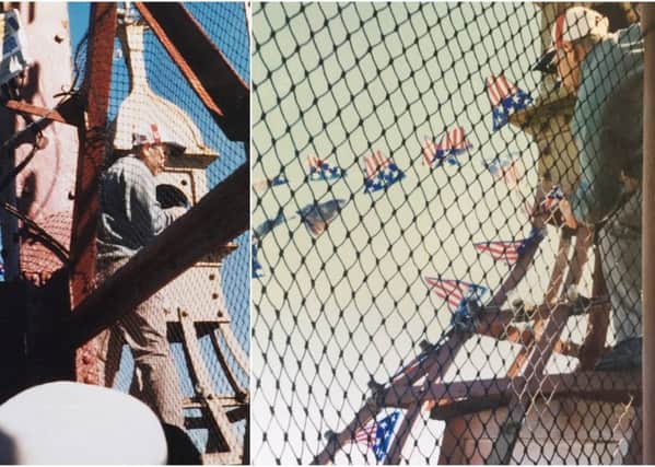 Pics taken at Blackpool Tower in 2002, of two men who climbed the tower, one of them cut through the rope netting to get right to the top of the tower. 
He was protesting about people from 9/11 dying and America's rights.
Pics taken by Maggie Valentine, of Northampton