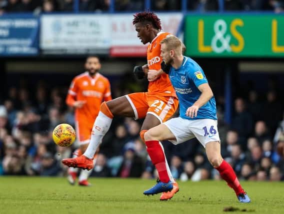 Blackpool's Armand Gnanduillet competing with Portsmouth's Jack Whatmough