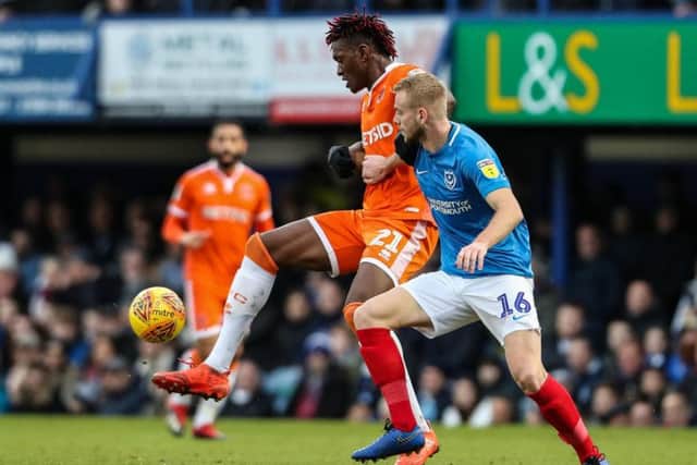 Blackpool's Armand Gnanduillet competing with Portsmouth's Jack Whatmough