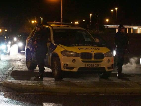 Police stood guard outside the civil service offices in Warbreck on Monday evening amid reports of a gunman
