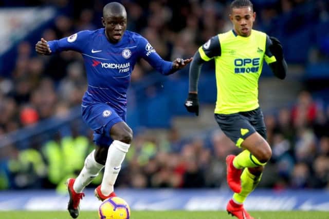 Chelsea's N'Golo Kante (left) and Huddersfield Town's Juninho Bacuna battle for the ball