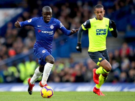 Chelsea's N'Golo Kante (left) and Huddersfield Town's Juninho Bacuna battle for the ball