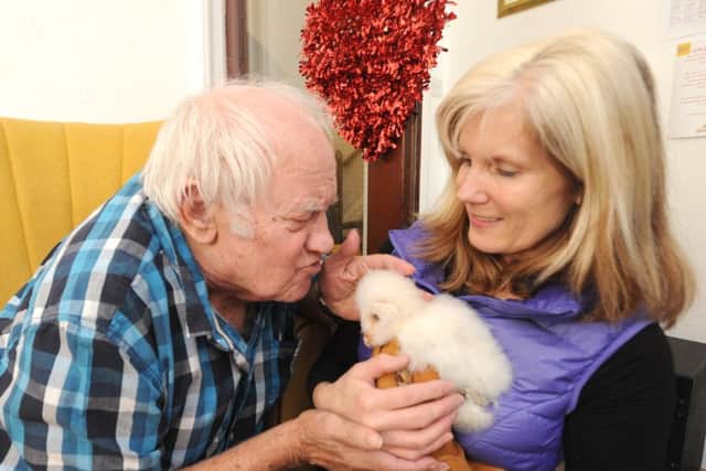 Karen Mankowska takes her owls to residents at The Knights Care Home.  She is pictured with Brian Rolands.