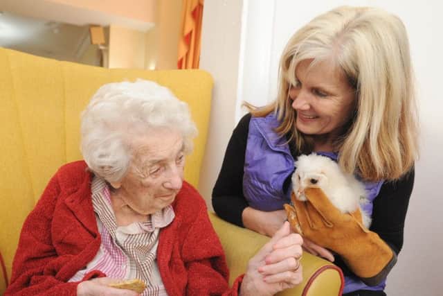Karen Mankowska takes her owls to residents at The Knights Care Home.  She is pictured with Edith Smith.