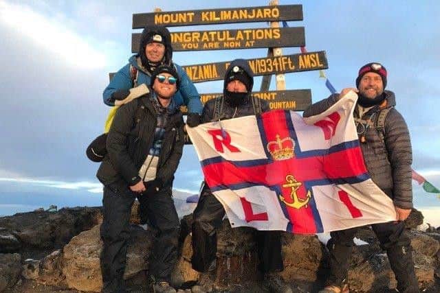 Chris Smith (back left) with Adam Tyres (front left), Ben Trotter (middle) and Darren Clemson at the summit