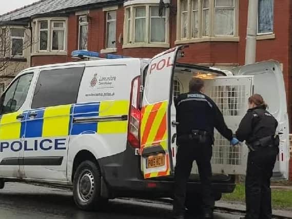 Police officers at the back of a van in Marton Drive, South Shore