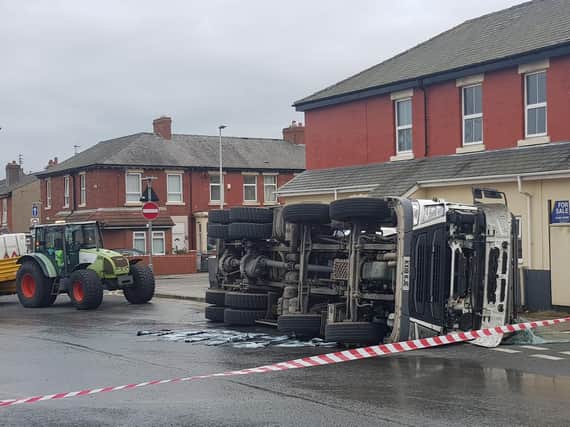 A cement mixer has overturned on George Street in Blackpool.