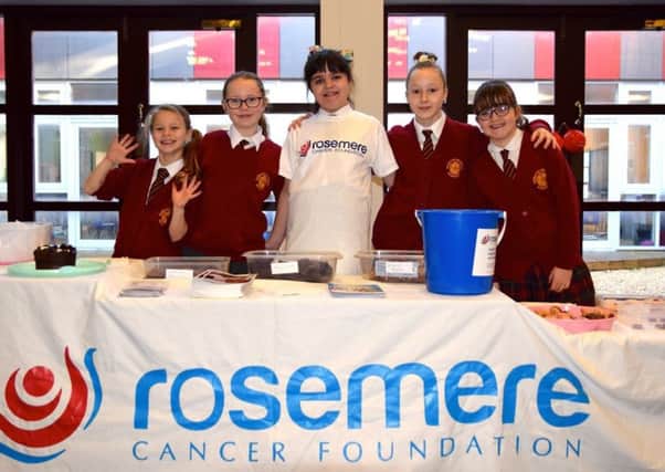 Niamh Wilson (centre) with her friends who raised money for the Rosemere Cancer Foundation