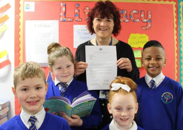 Mereside Primary School's headteacher Sarah Bamber with, from left to right: Nathan Andrew, seven, Connie-May Butcher, 10, Hallie-Jay Cundliffe, seven, and Raheem Sowe, nine