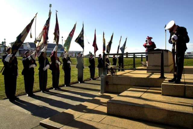The standard bearers on parade as the last post is played at the HMS Penelope wreath laying ceremony at Blackpool Cenotaph, in 2004