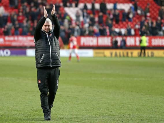 Terry McPhillips applauds the fans at the final whistle