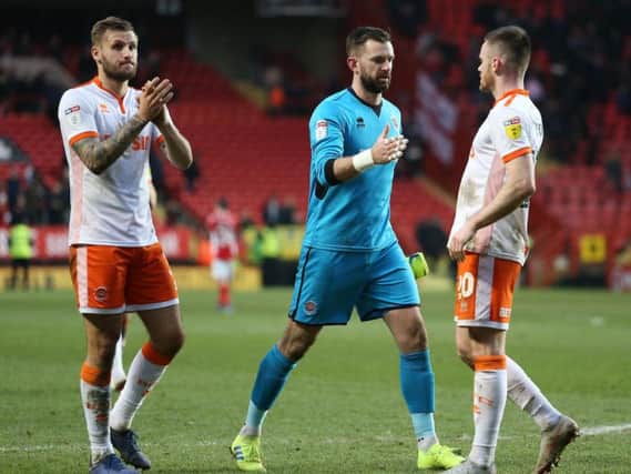 Nick Anderton, Mark Howard and Ollie Turton head over to applaud the Blackpool fans after Saturday's 0-0 draw against Charlton