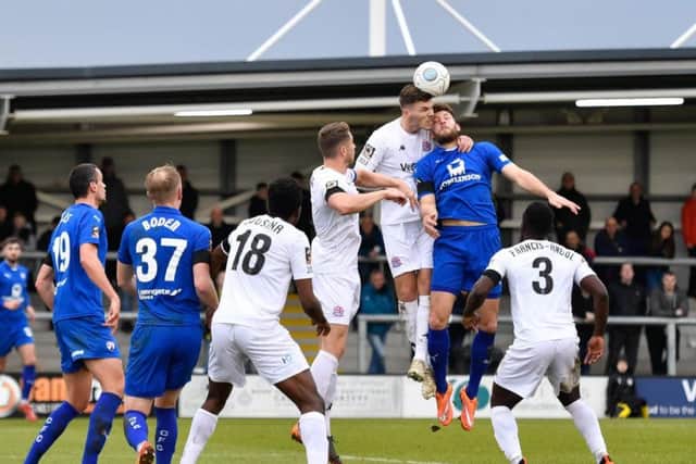 Jordan Tunnicliffe beats Chesterfield's Will Evans to a header: Picture by Steve Flynn/AHPIX.com