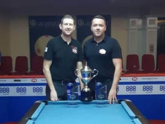 Lee Clough (left) and Jack Whelan with their world doubles trophy