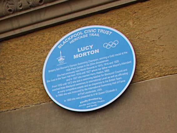Blue Plaque of Lucy Morton, 1924 Olympic Gold Medal winner, on the Town Hall entrance at Talbot Square.