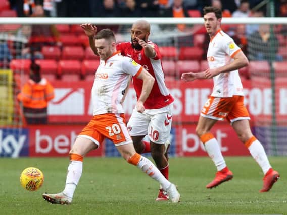 Ollie Turton is happy to switch roles at Blackpool as long as he remains in the starting 11