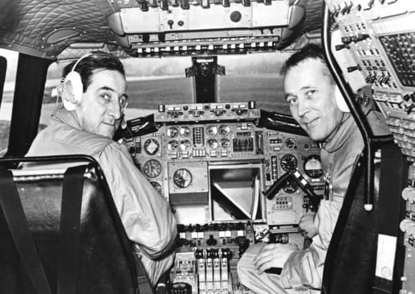 Test pilot Brian Trubshaw (left) and his co-pilot John Cochrane pictured in the cockpit of the Concorde 002 aircraft as they prepare to take off for the first time, at RAF Filton, Bristol, April 9 1969. (Photo by George W. Hales/Fox Photos/Getty Images)
