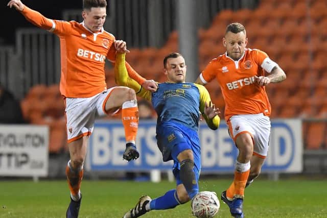 Blackpool's Jay Spearing (right)
