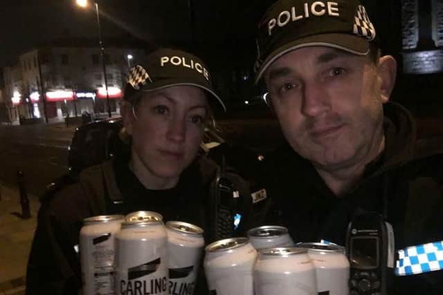 Emma Pritchard and PC Kev Berry with some of the alcohol bought as part of the test purchasing operation in Wyre. Photo: Lancashire Police