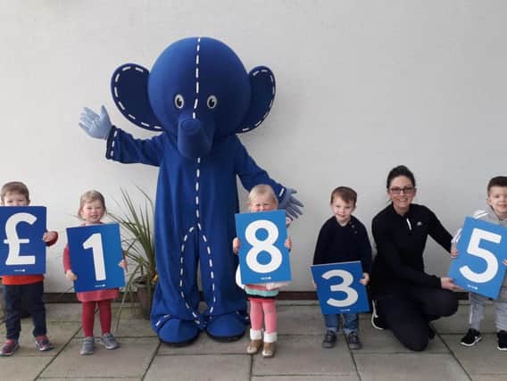 Tristan Campbells Puddle Ducks swimming friends with Oli,  Alder Hey Childrens Charity's mascot