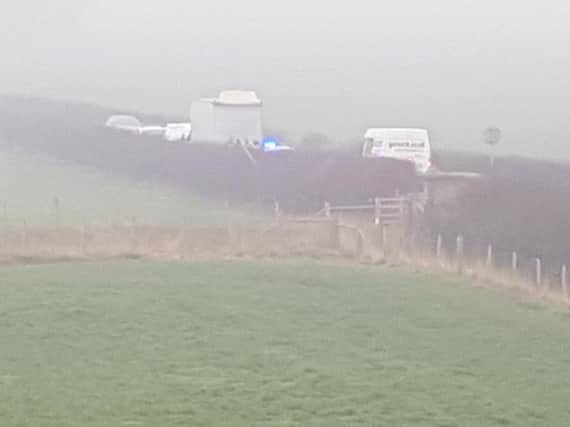 A lorry has hit a railway bridge.