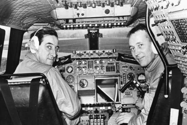 Test pilot Brian Trubshaw (left) and his co-pilot John Cochrane pictured in the cockpit of the Concorde 002 aircraft as they prepare to take off for the first time, at RAF Filton, Bristol, April  1969. (Photo by George W. Hales/Fox Photos/Getty Images)